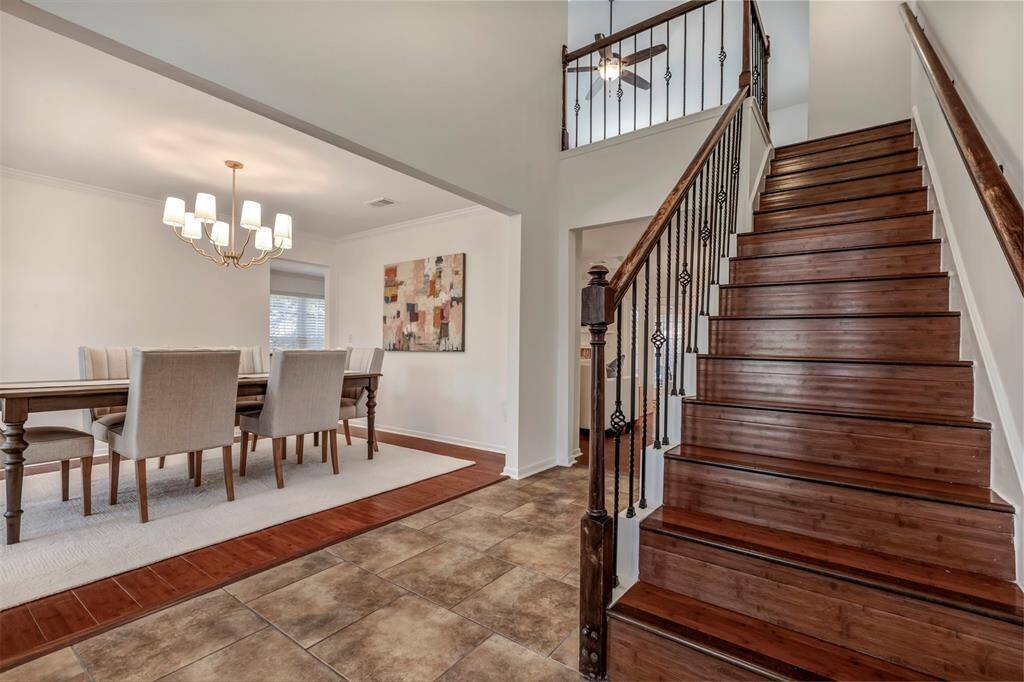 View of entry with dining room and kitchen to the left