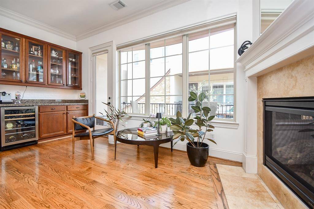 Sitting area by the fireplace bar area and access to large balcony.