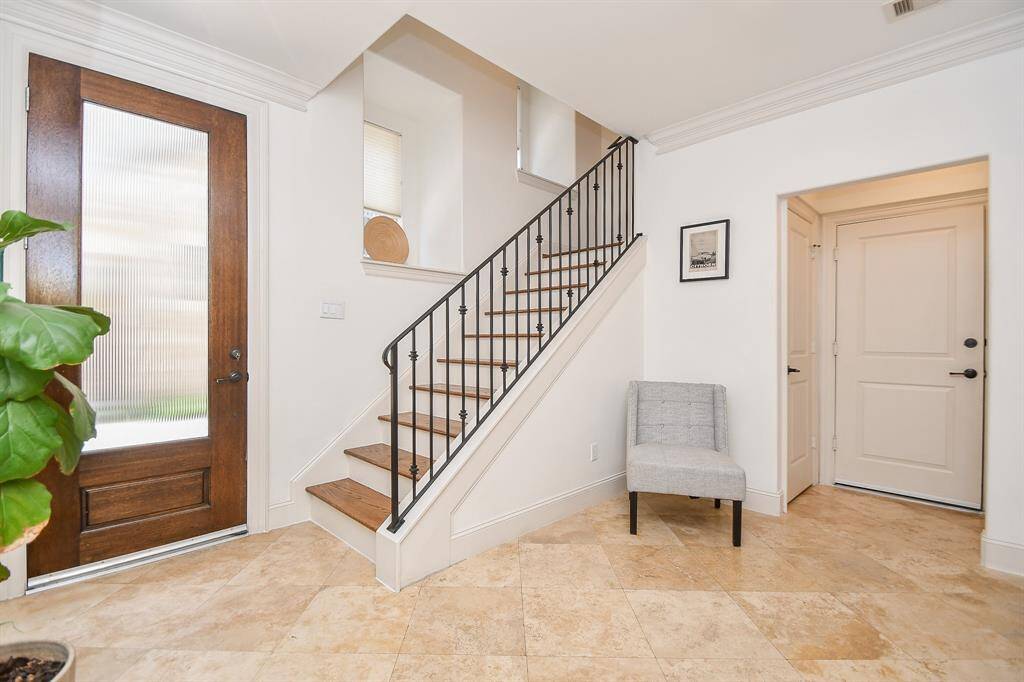 Lovely travertine floored entry with loads of natural light.