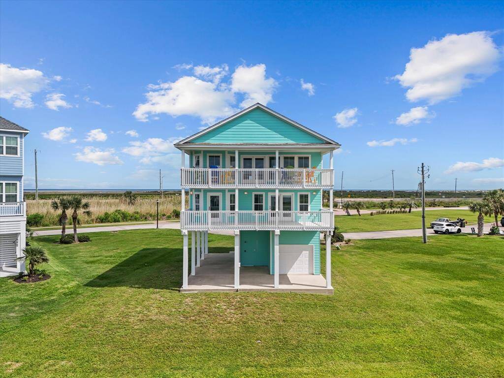 This stunning coastal home welcomes you with timeless seaside charm and modern elegance