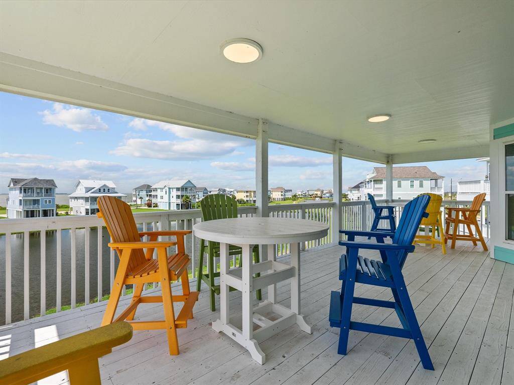 Glass doors open onto a large balcony—ideal for entertaining, relaxing, or soaking in the surrounding scenery.
