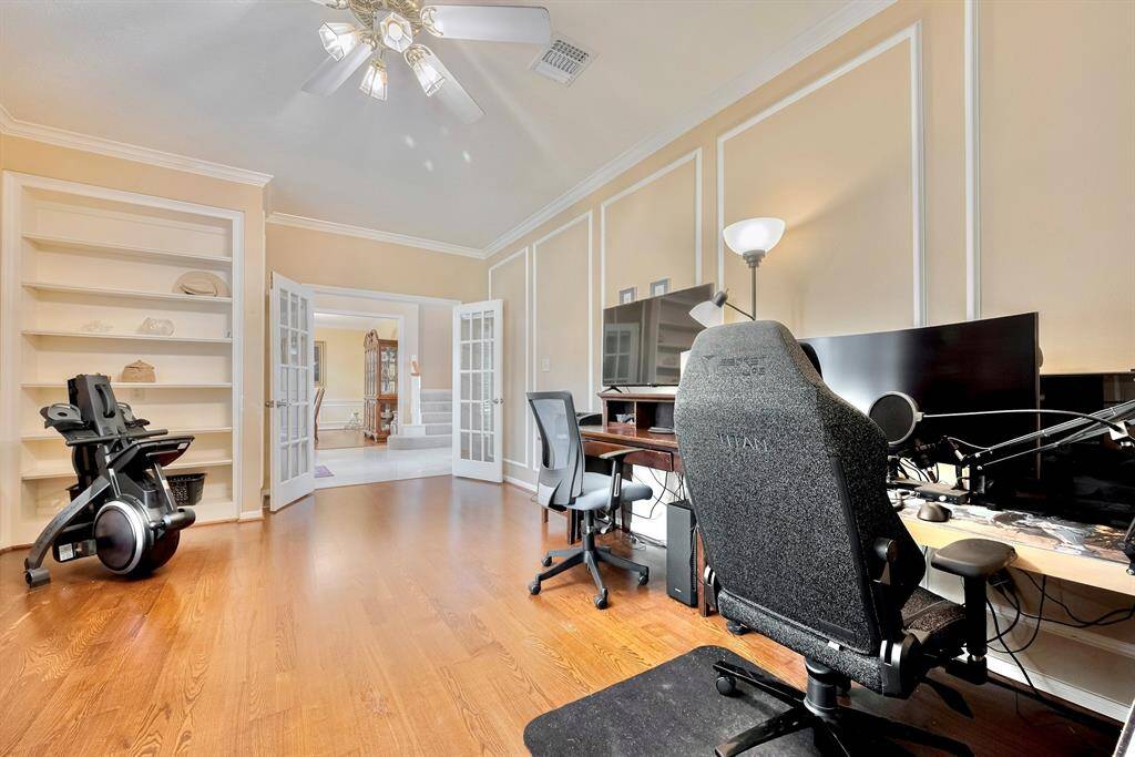 A view of the office/study on the first floor featuring french doors