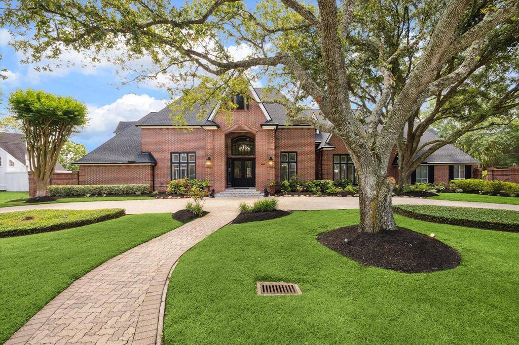Distinguished luxury custom estate home situated on 1/2 acre in the desired established pocket neighborhood of Fieldcreek Forest. Brick paved circle driveway