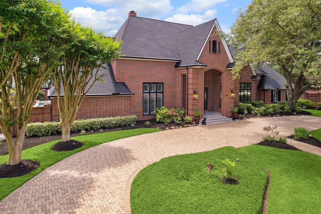 Circle driveway with brick pavers.