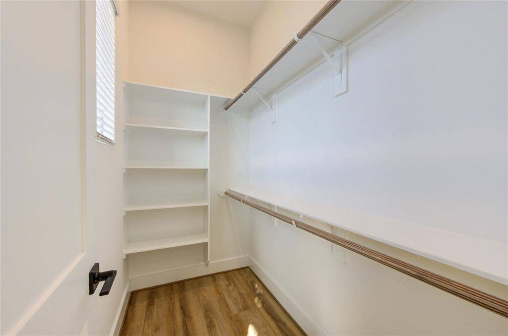Primary bedroom closet 1.