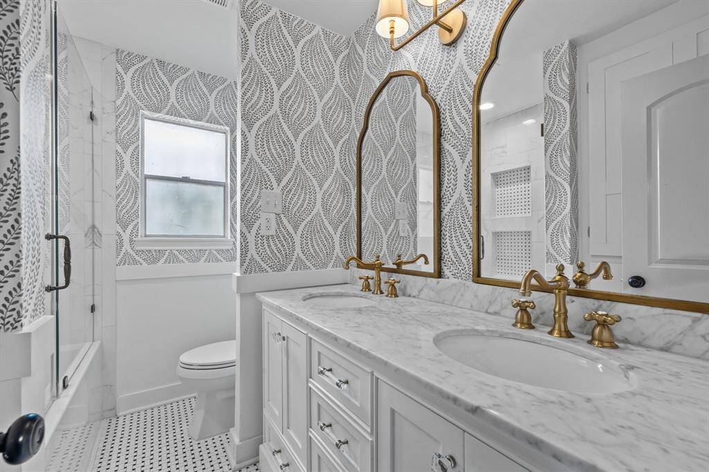 Second Level Primary Bathroom featuring new vanity, countertop, tiles, tub, shower surround, glass shower, lighting and hardware
