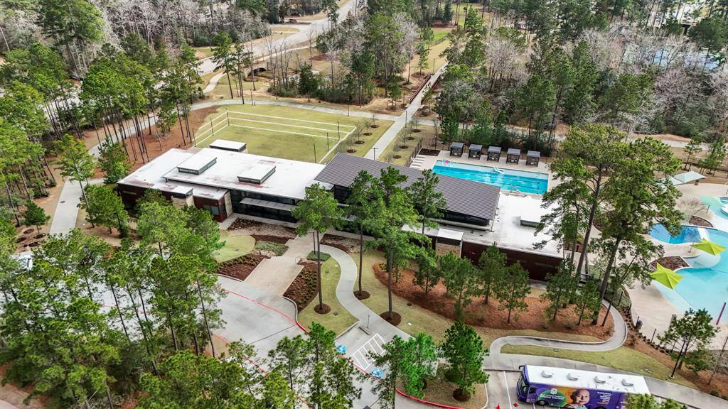 The Woodlands Hills amenity center offers a resort-style experience with a spacious pool, a state-of-the-art fitness center, and ample outdoor areas for recreation. Residents can enjoy walking trails, playgrounds, and a community pavilion for gatherings and events. Whether you're looking for relaxation or an active lifestyle, this community has something for everyone.