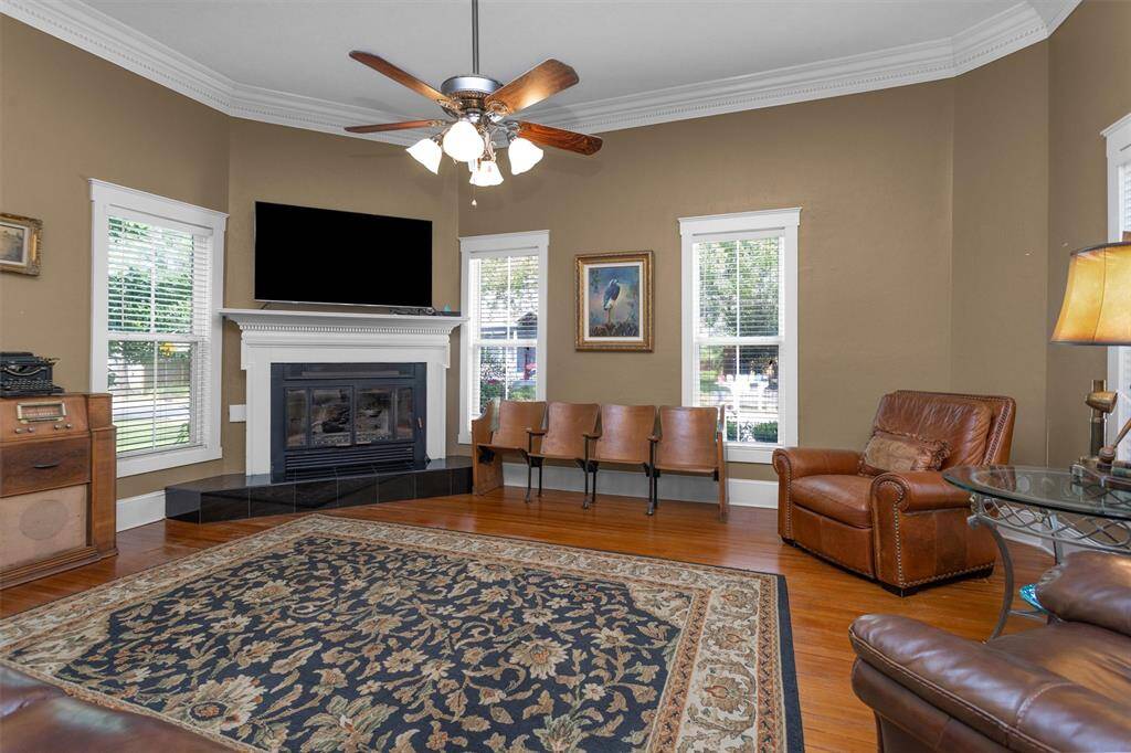 The living space boasts unbelievable original crown molding  and a gas fireplace. One of the only orginal rooms.