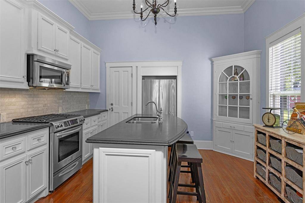 The kitchen features 2 original built-in cabinets that were relocated from a secondary bedroom.