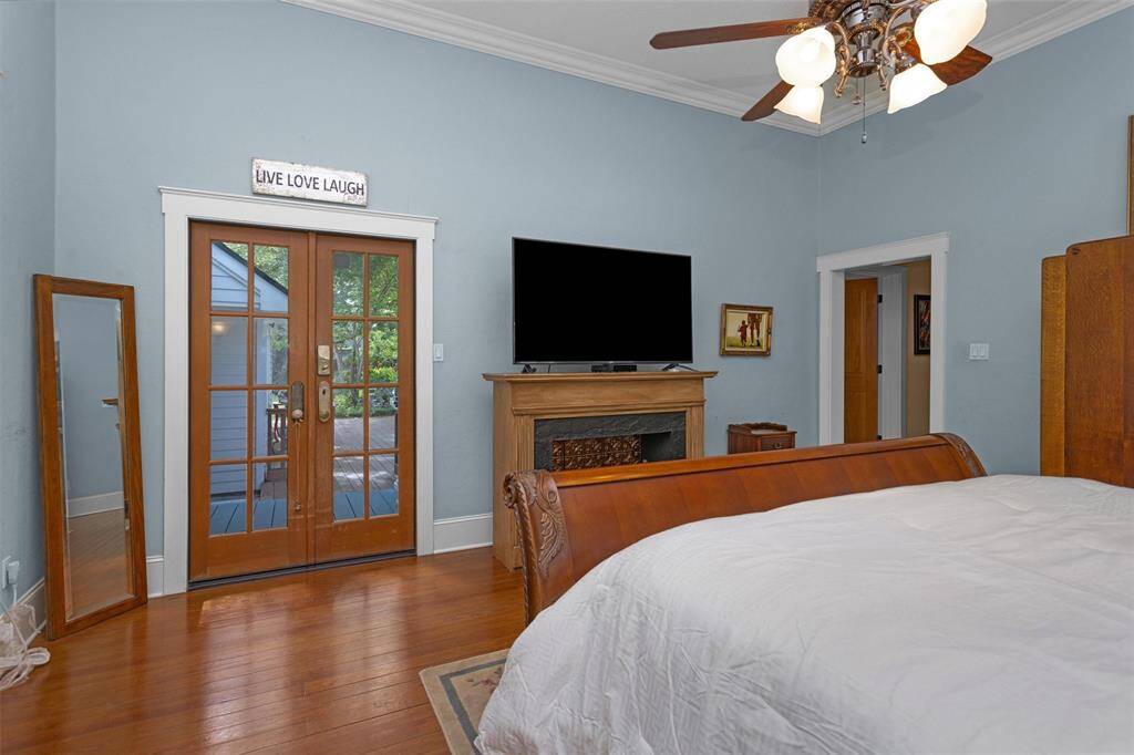 Double french doors in the primary suite provide a private entry to the oversized deck.