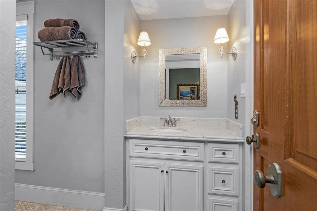 Inside the spa-like primary bathroom, double separated sinks allow for more space and storage.