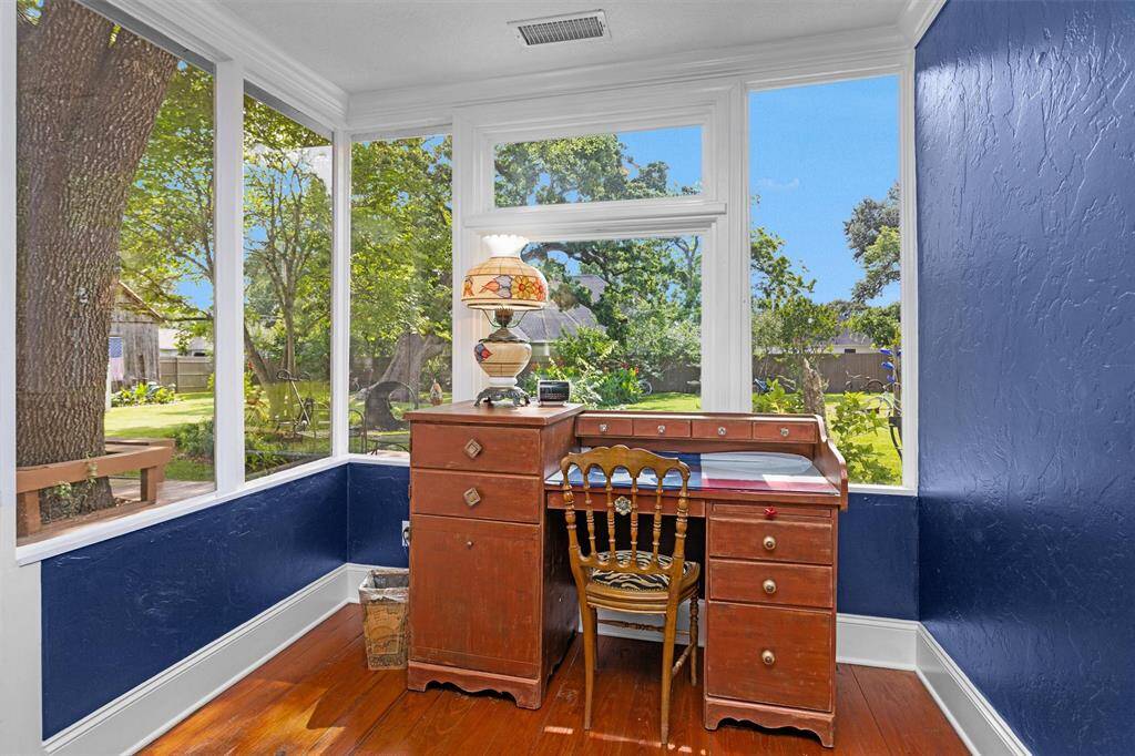 The sunroom overlooks the gorgeous back yard and the 180+ year old pecan tree.