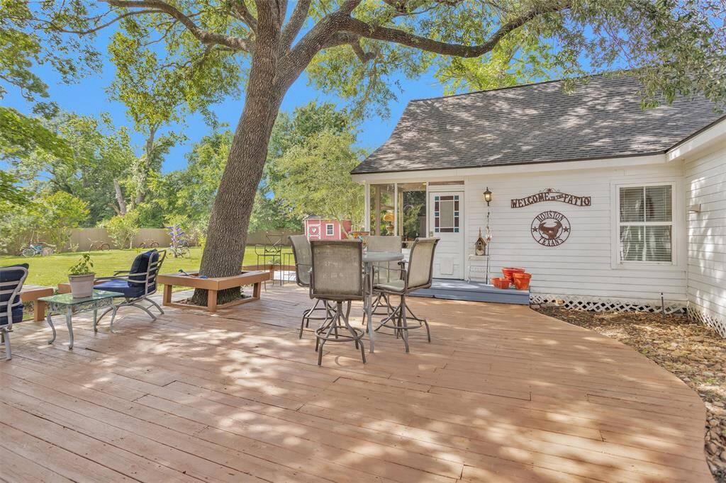 The deck built around a stunning hardwood tree.