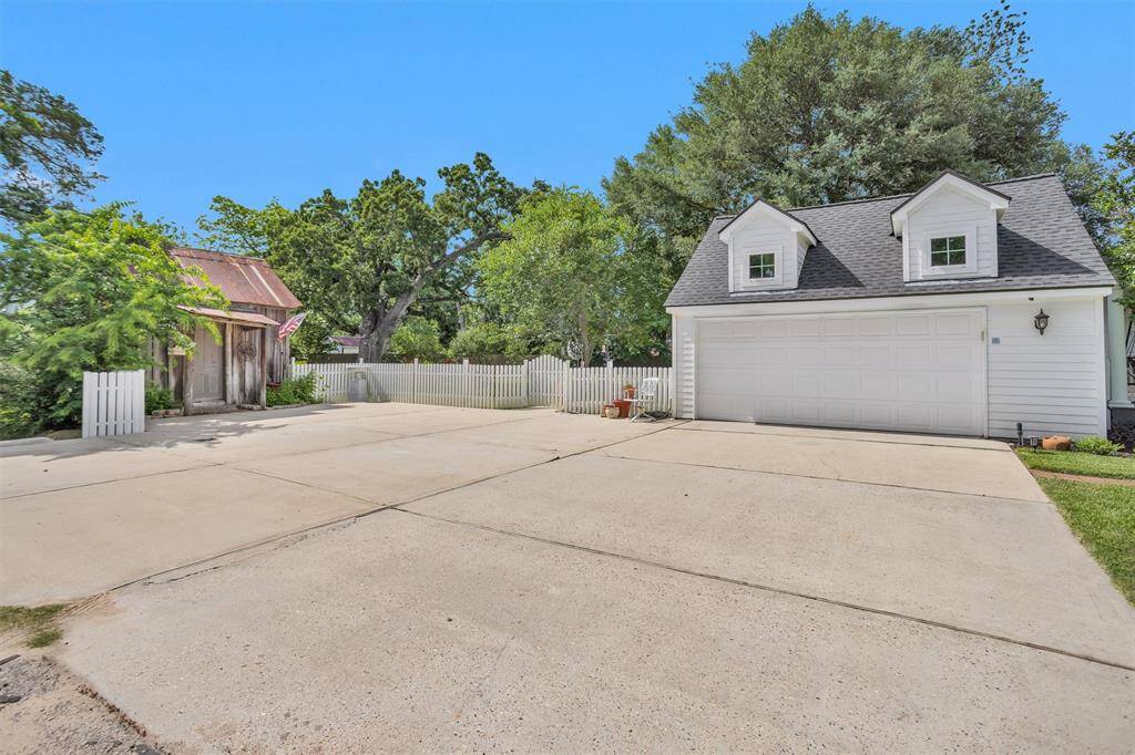 The detached 2 car garage is completely decked in the attic space for additional storage use. Additional concrete was added to the driveway to provide additional parking.