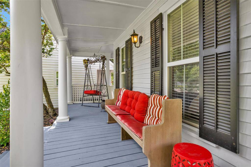 Black original shutters offset the bright white siding for the optimal POP of color.