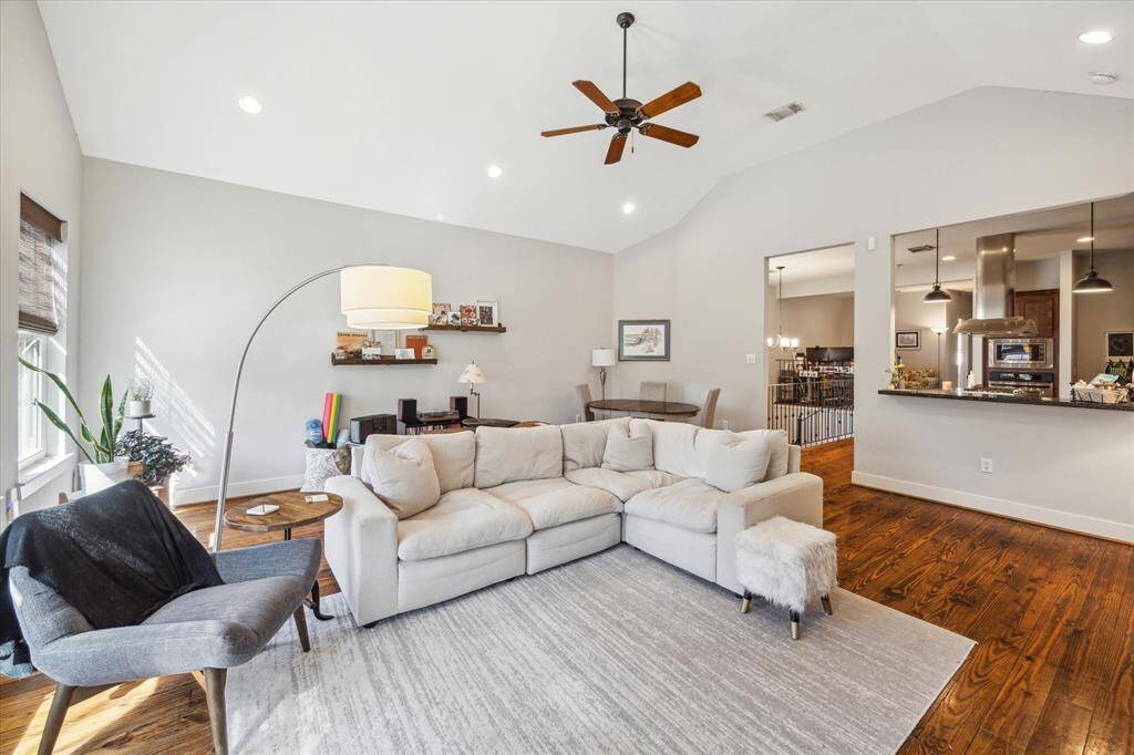 Elevate your living experience with this airy second-floor space featuring soaring ceilings.