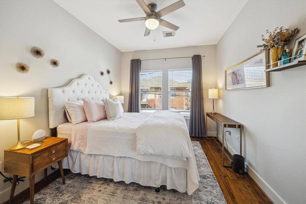 Cozy upstairs second bedroom with abundant natural light.