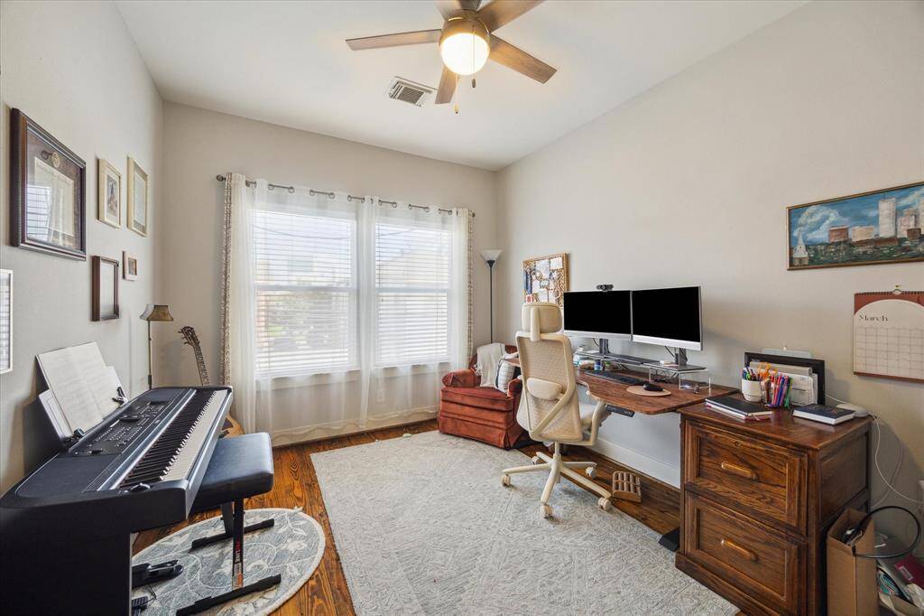 Bright and versatile third bedroom, perfect as a home office or creative space.