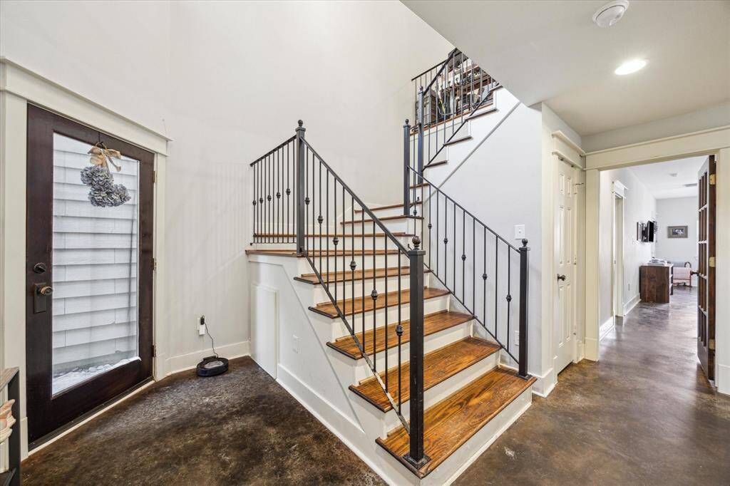 Stylish concrete flooring enhances the entire first floor.