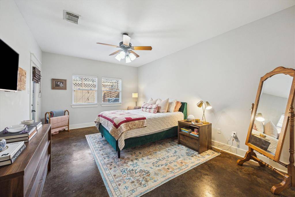 Spacious primary bedroom on the first floor with ample natural light and modern amenities.