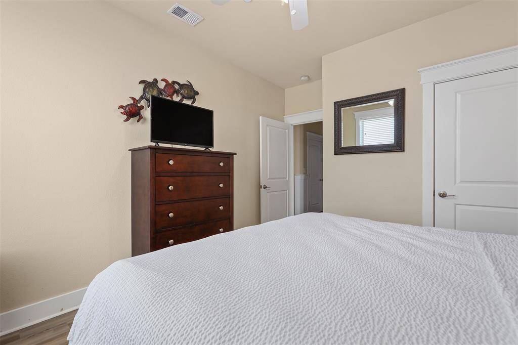 Whimsical artwork add unique touches to the second bedroom, making this space perfect for guests to relax and enjoy their stay.