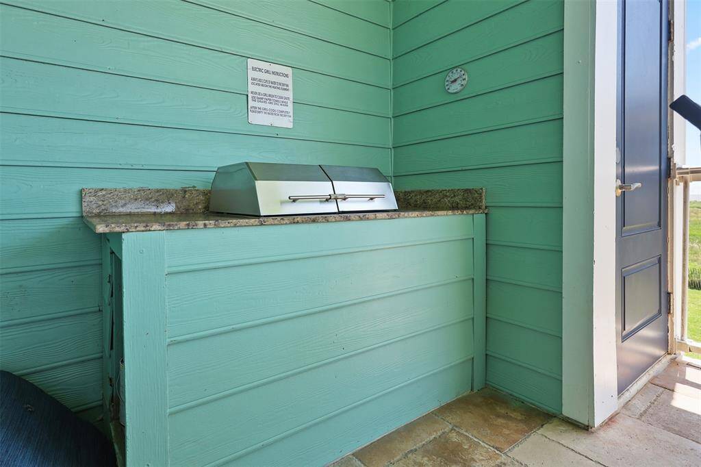 Embrace outdoor living with a charming grilling station, perfect for summer barbecues and al fresco dining.