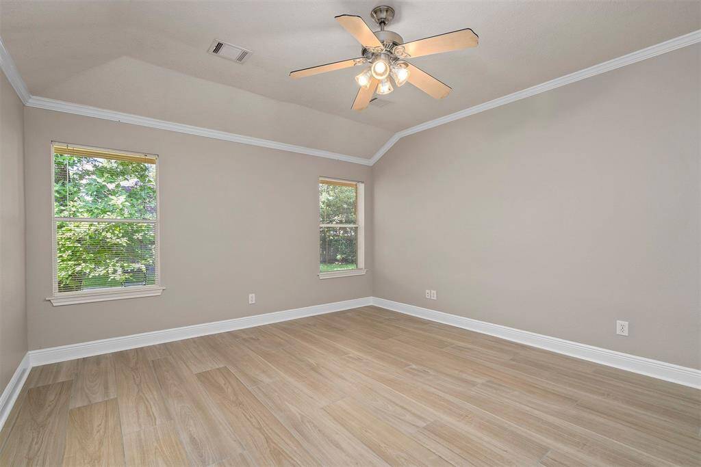 Master bedroom with large windows over looking backyard!