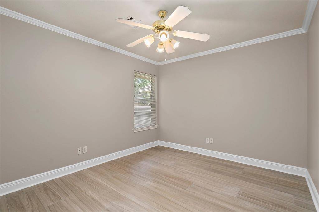 Third bedroom with ceiling fan and crown molding!