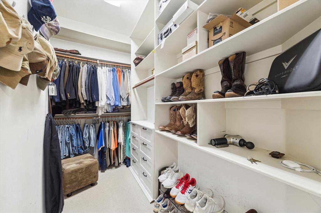 One of two large walk in closets in the primary bath area.