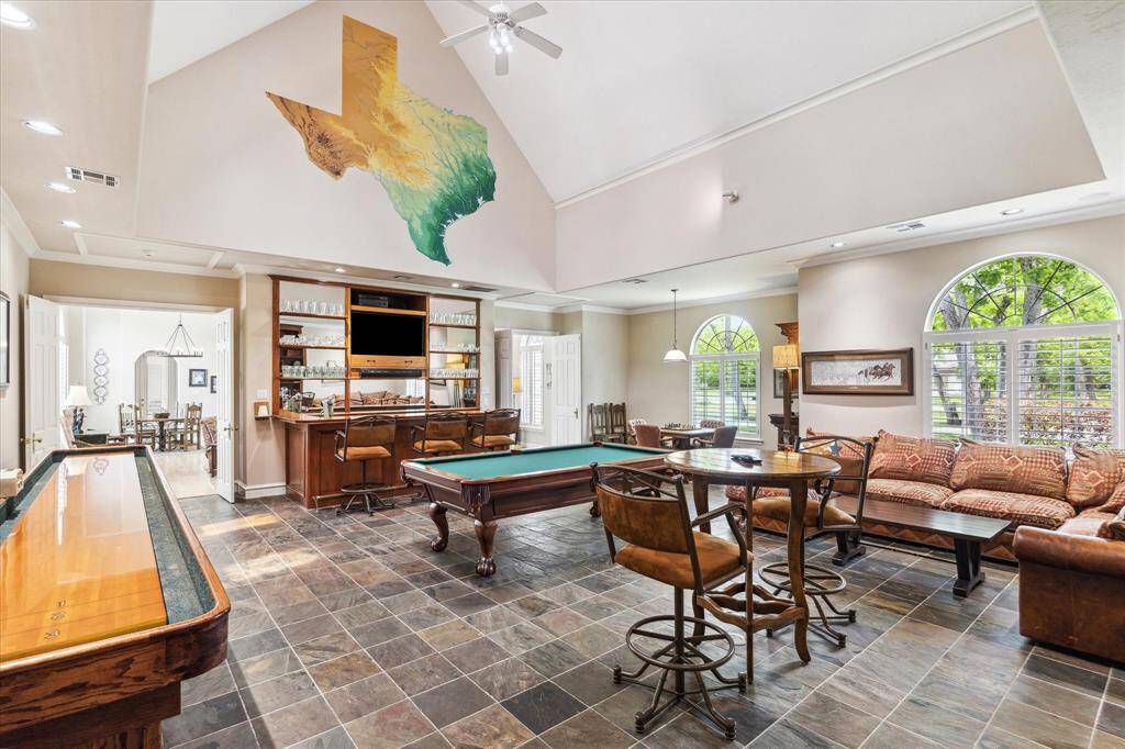 If you need a space to entertain a large number of people, this is your house! The bar area has a sink, a small refrigerator and plenty of space for mixology, a coffee bar, or even an ice cream social.