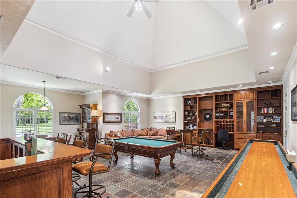 The floors are slate for easy clean up. The back wall has custom built in cabinetry to store your fishing and hunting equipment.