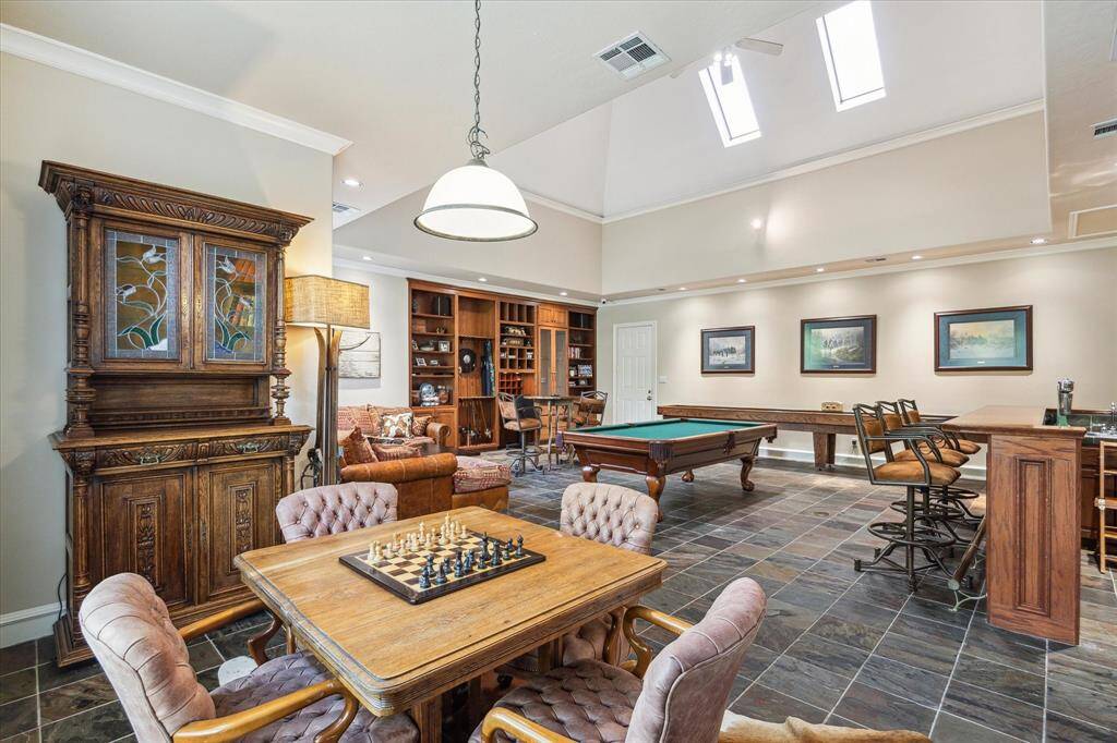 Tucked into one corner of the room is a game table for more intimate gatherings.