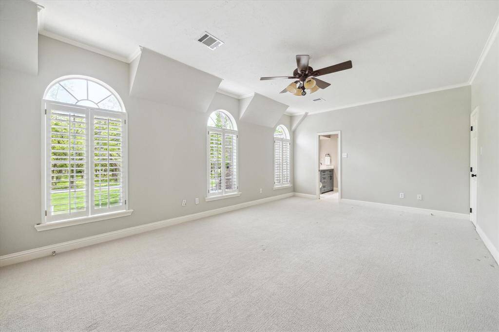 The largest of the three upstairs bedrooms. It has two walk in closets.