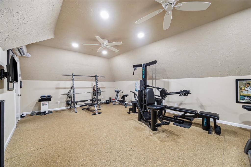 This fitness room is above the garage and is air conditioned with a mini split system that can be controlled on your phone.