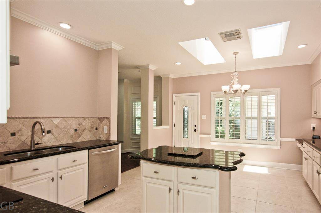 This spacious kitchen and informal eating area has seamless access to living area.