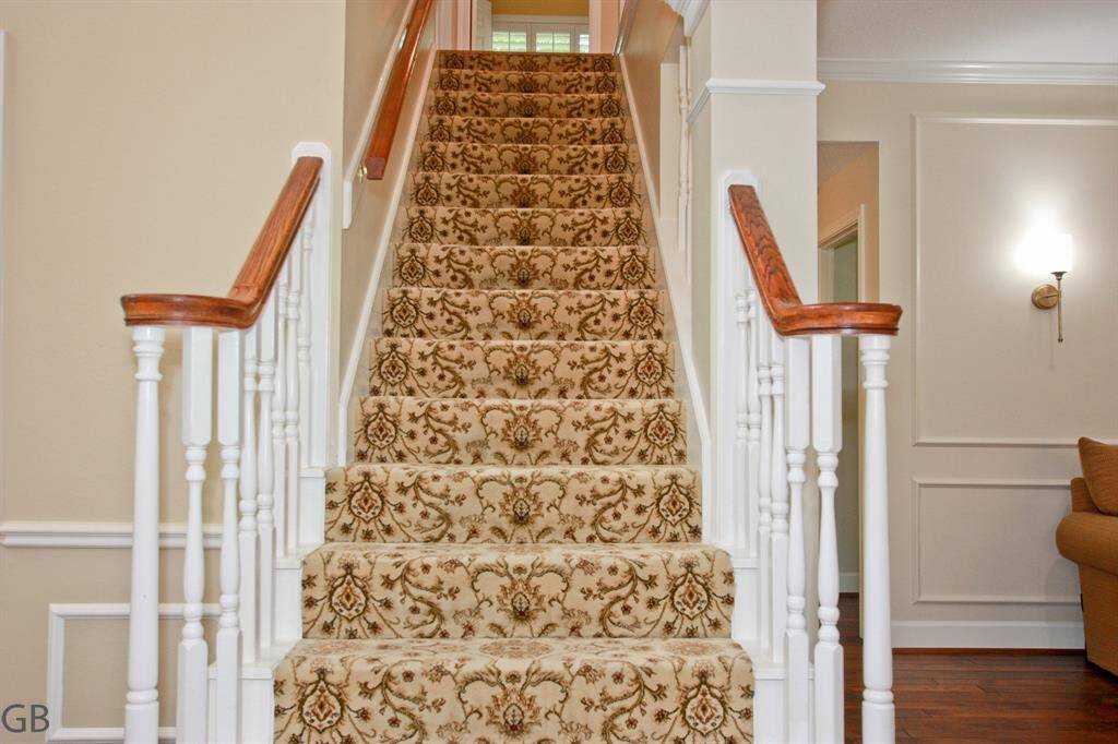 These carpeted stairs complement the interior of the home and help with slipping and noise reduction.
