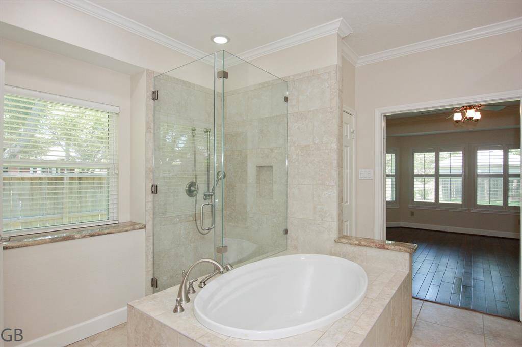 Separate seamless shower and garden tub.