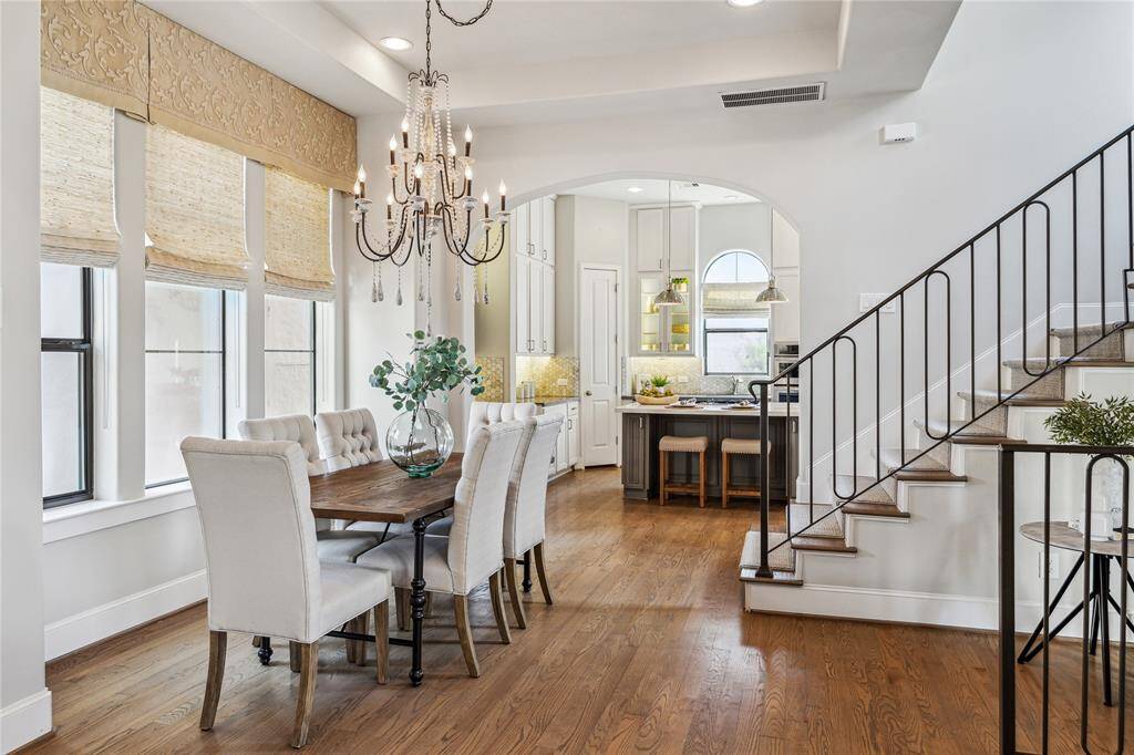 DINING.  Has it's own elegant space and is not simply an extension of the living area where you'd stick a table!   Huge windows for terrific natural light.