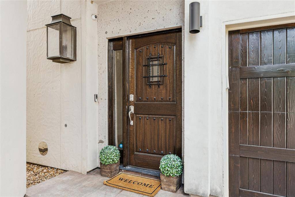 ENTRY. The quality put into this community of townhomes is evident as soon as you reach the solid wood front door. Note the clay tile roofs.