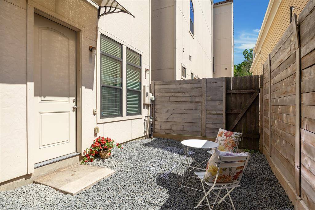 OUTDOOR PATIO.  The third of the three outdoor spaces.  Currently gravelled but you could easily turf, pop in some planters and string lights and create your own private dining space.