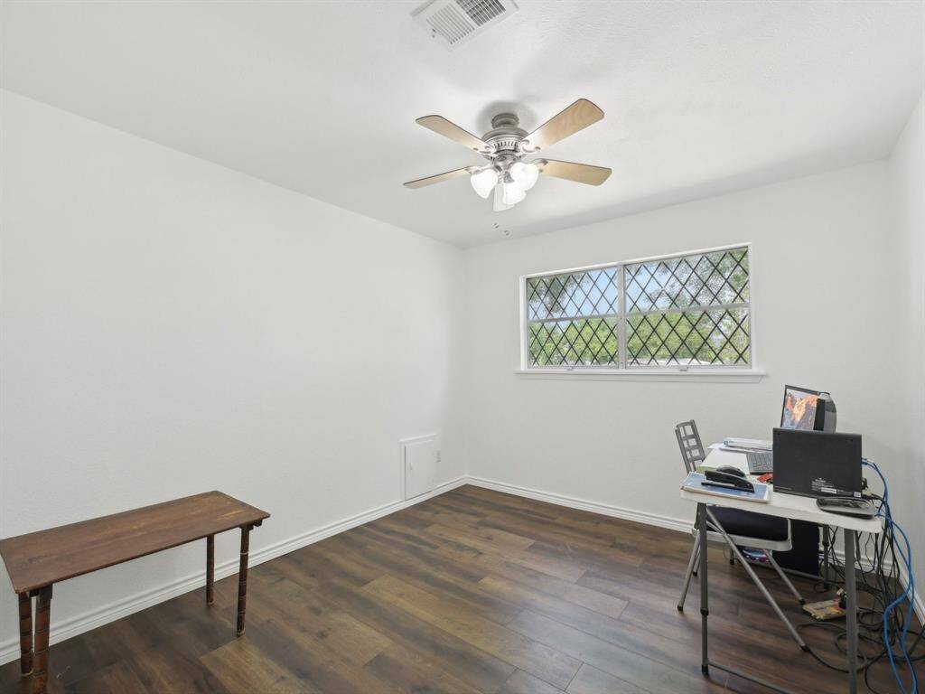 This bedroom is being used as an office.