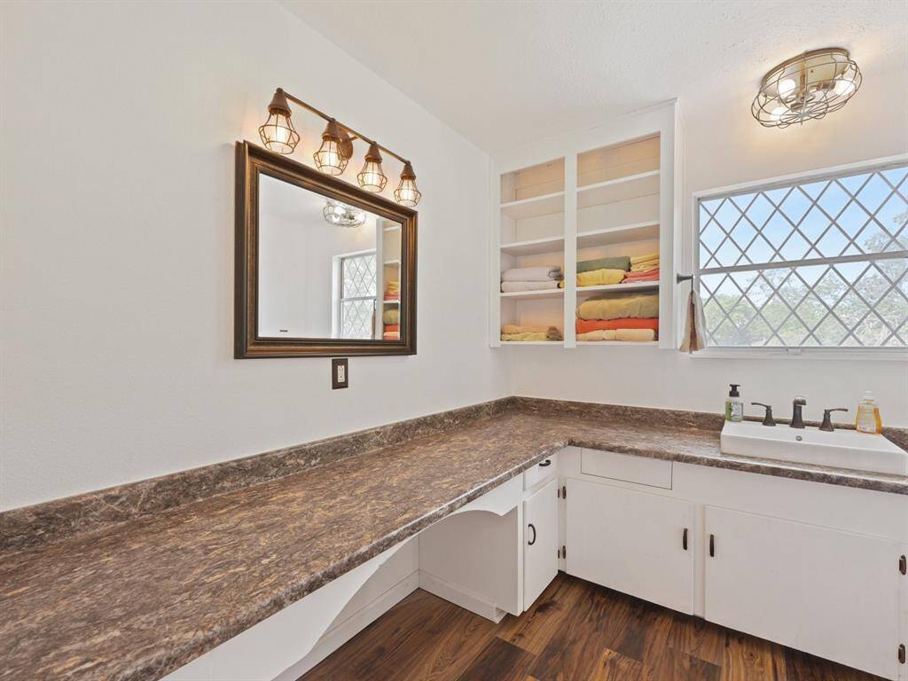 The upstairs bathroom has an abundance of counter space so everyone has room for their essentials.