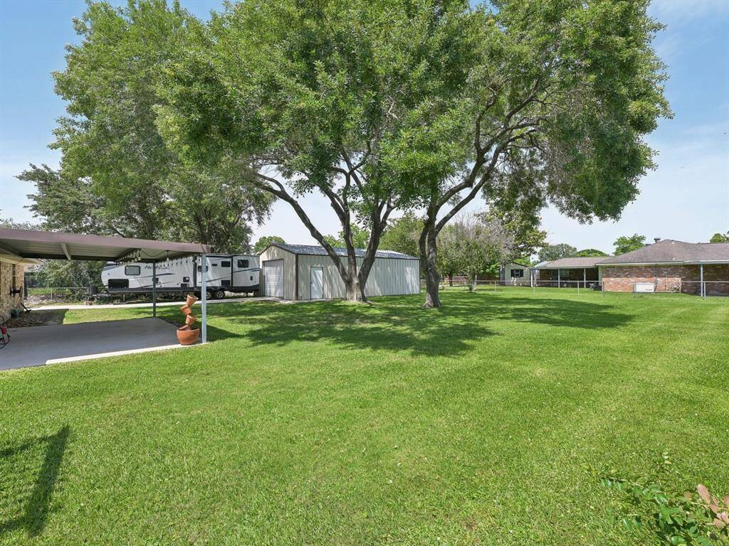 This backyard is huge! Build a treehouse or put up a swing and live your best life.