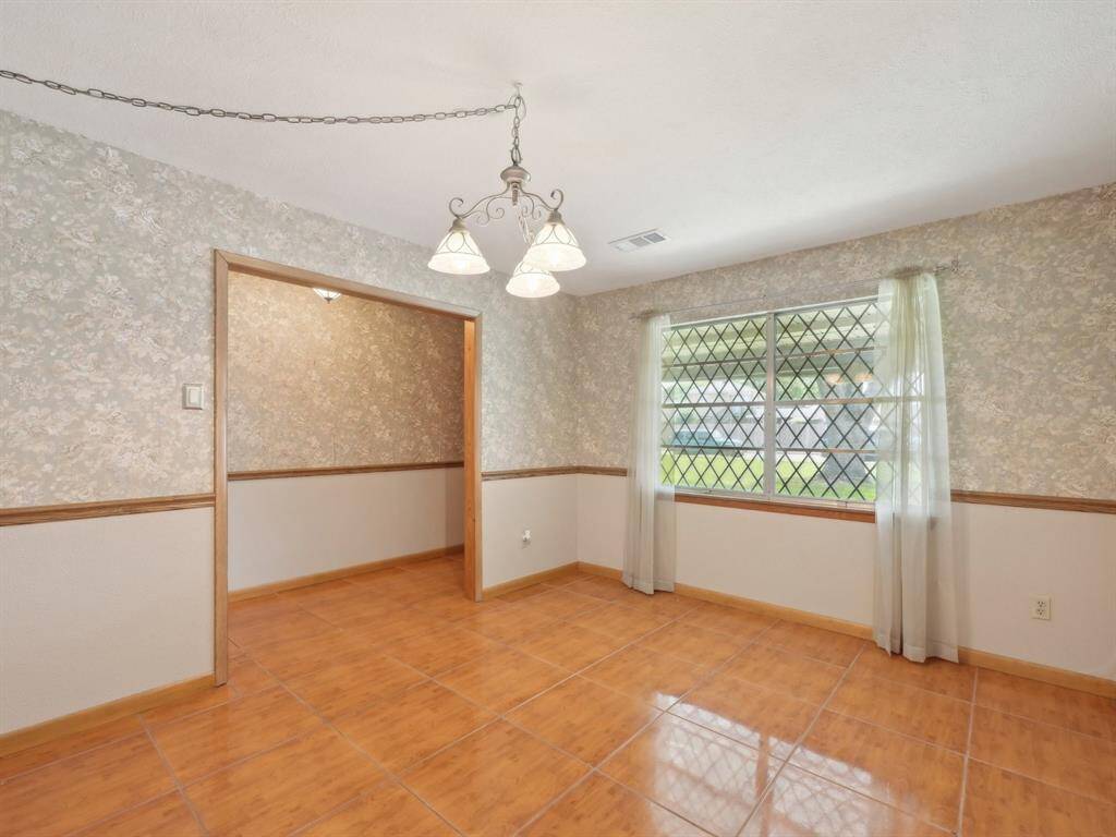 The Formal Dining is the focal point for your gatherings. This room could easily be converted to an office with the addition of French doors.
