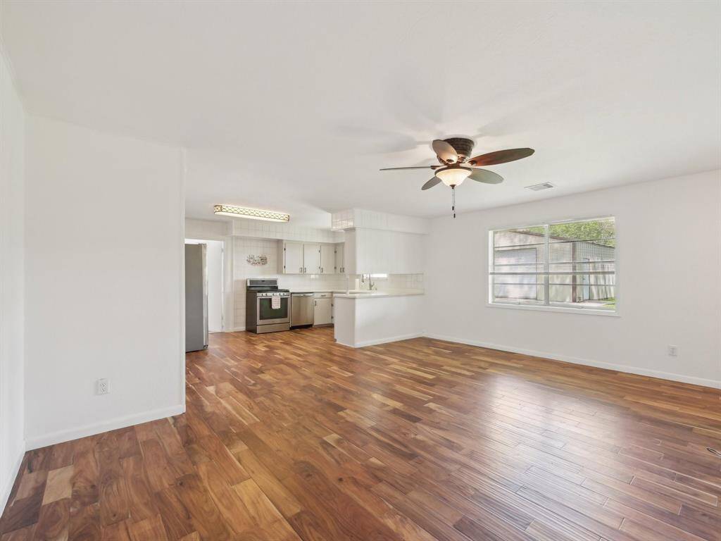 Gorgeous engineered hardwood flooring adorns the Family Room and Kitchen.