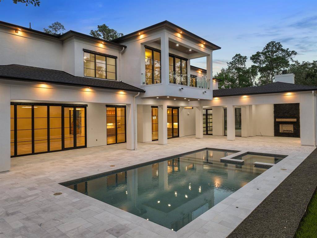 Claim this exquisite outdoor space just in time for summer entertaining and enjoy a sparkling swimming pool and spa, marble sundeck, beautifully equipped outdoor kitchen and a convenient pool bathroom.