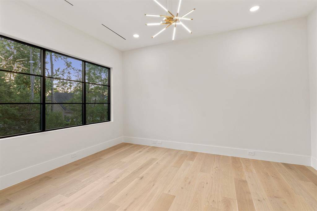Located just off the primary bedroom, this private sitting room is perfect for a TV lounge, home office, fitness space or second walk-in closet.