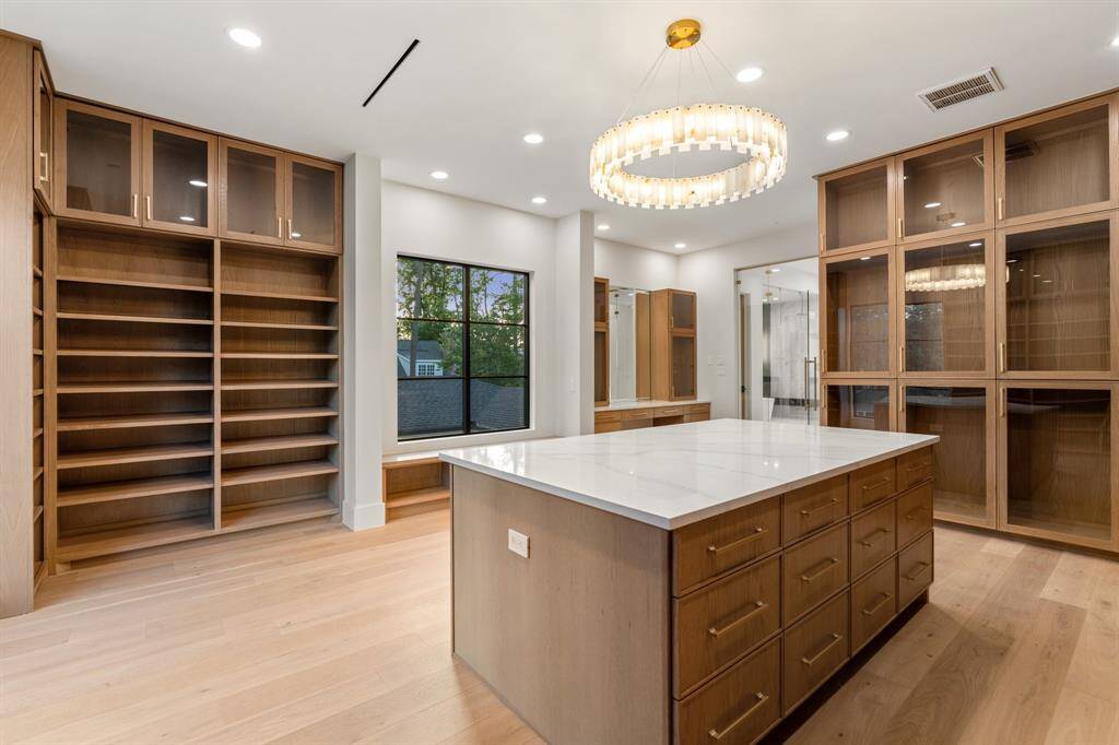 Between the walk-in closet and bathroom, a secret staircase provides direct access to the mudroom entry below.