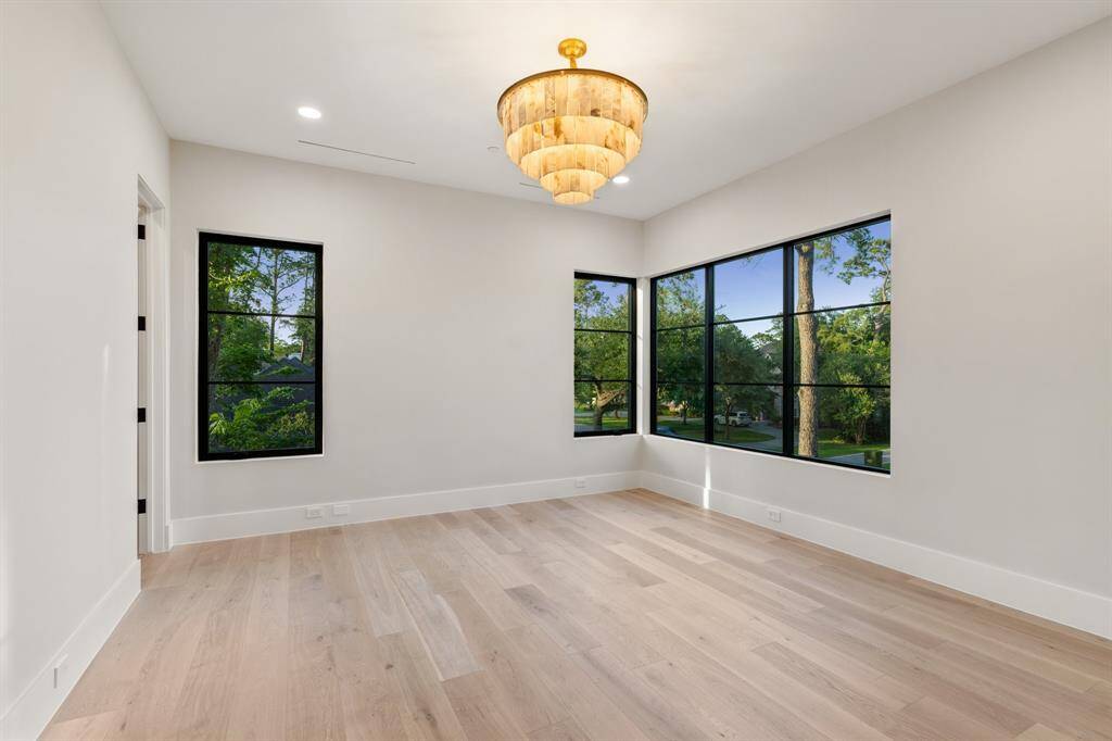 Northern and eastern exposures wrap around this 15-foot by 14-foot secondary suite featuring beautiful lighting, a private bath and a custom walk-in closet.