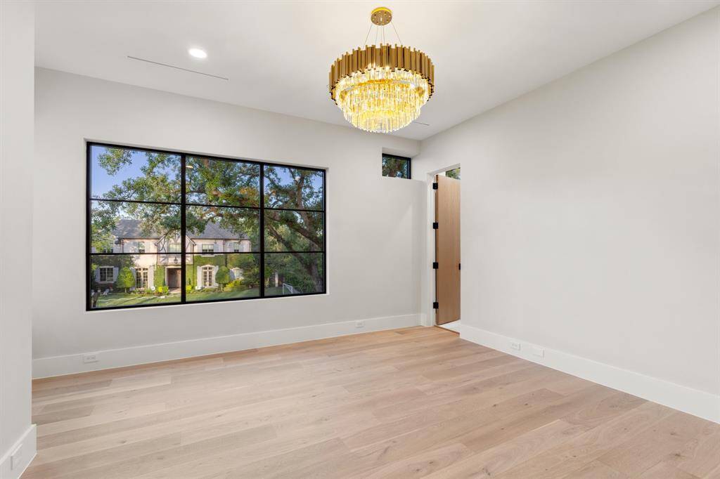 The 14-foot by 14-foot secondary suite enjoys northern and eastern treetop views, bold lighting, a reach-in closet and a private bathroom.